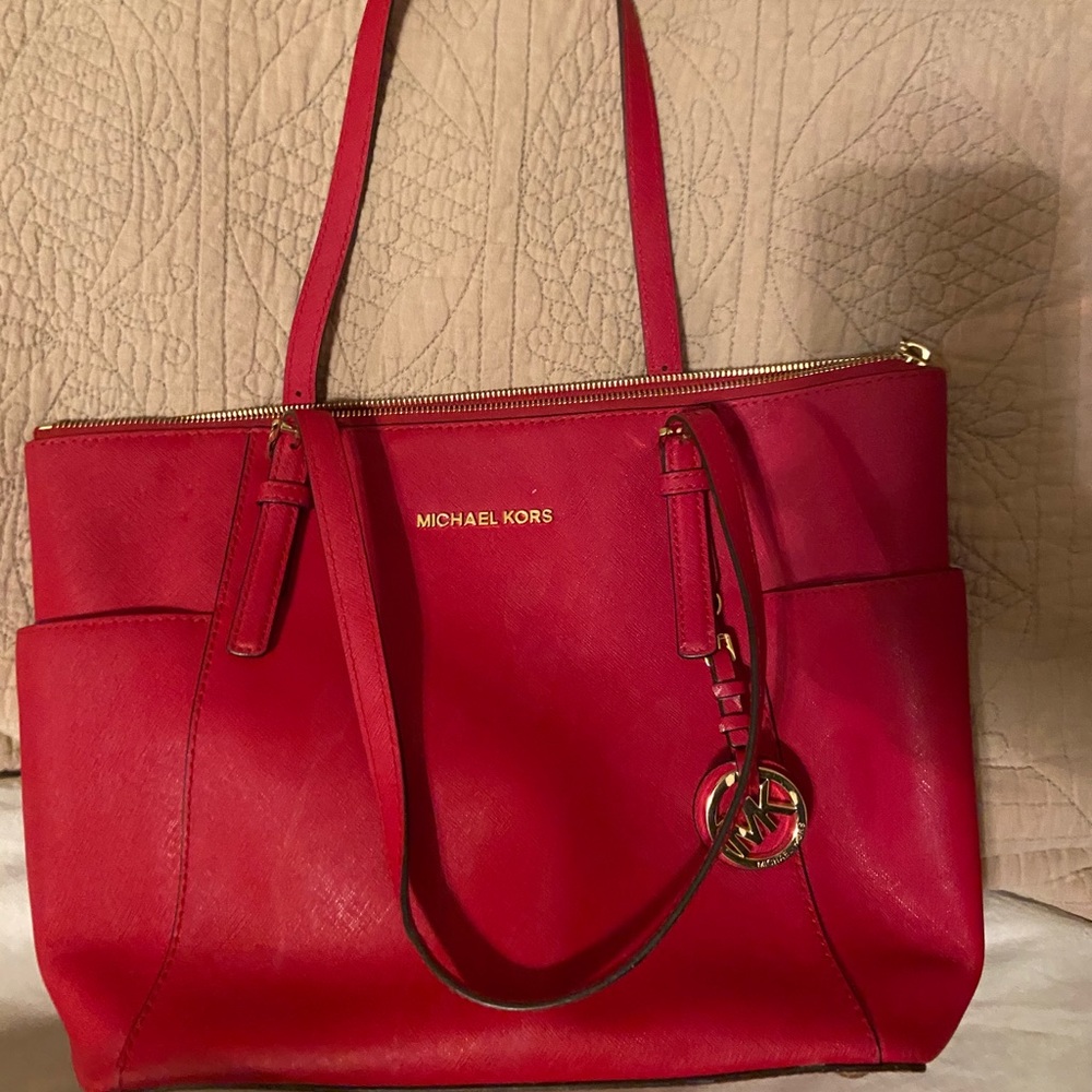 Michael Kors red purse.